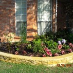 rockwall garden raised above lawn