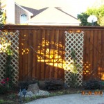 Custom Fence with Lit Garden and Climbing Trellis